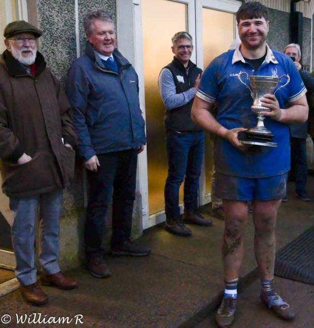 Delighted Blues skipper Karl Busch with the Bishop Cup